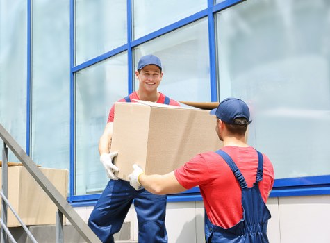 Professional movers handling furniture in Shoreditch