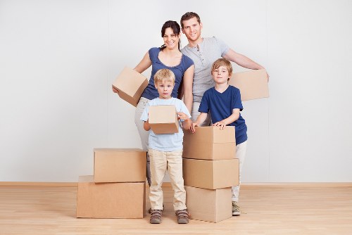 Removalists packing fragile items with care